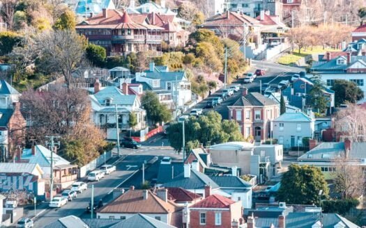 Hobart skyline with rental price trend graph overlay.